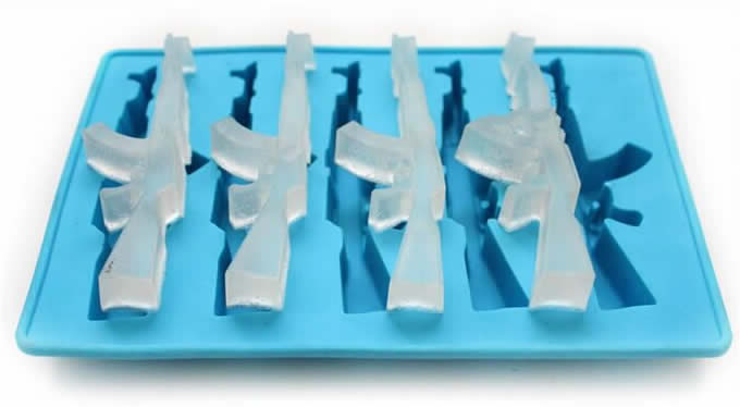 Blue ice cube gun mold with four gun-shaped ice cubes