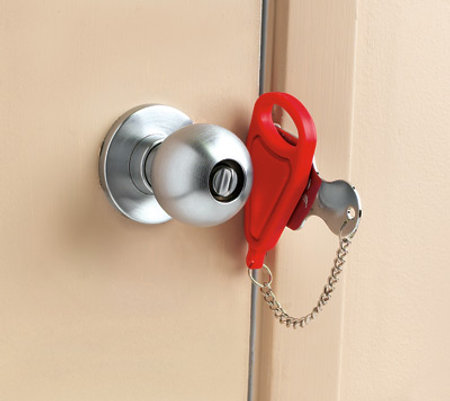 A red universal lock door between a skin door and skin wall