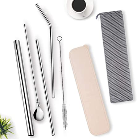 Metal Straws with holders, brush and small fern on the side and a cup of coffee above