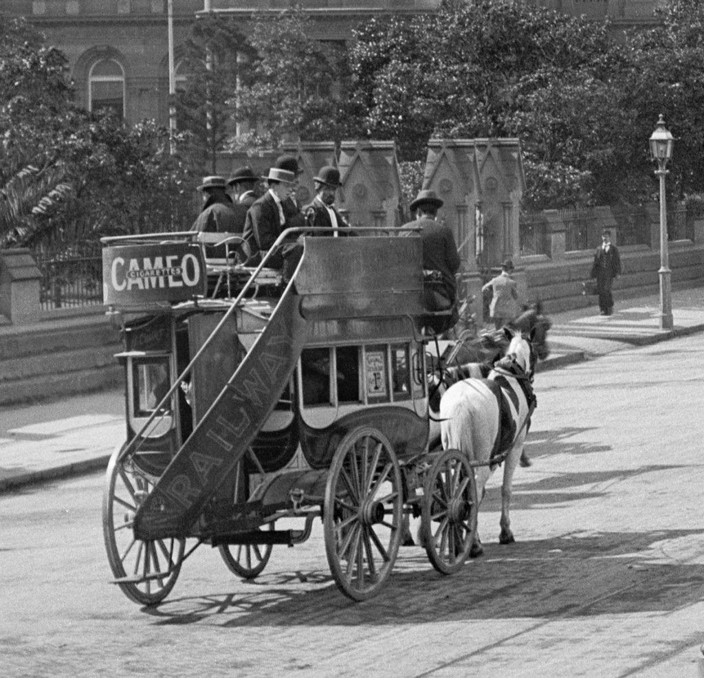 People riding on horse omnibus