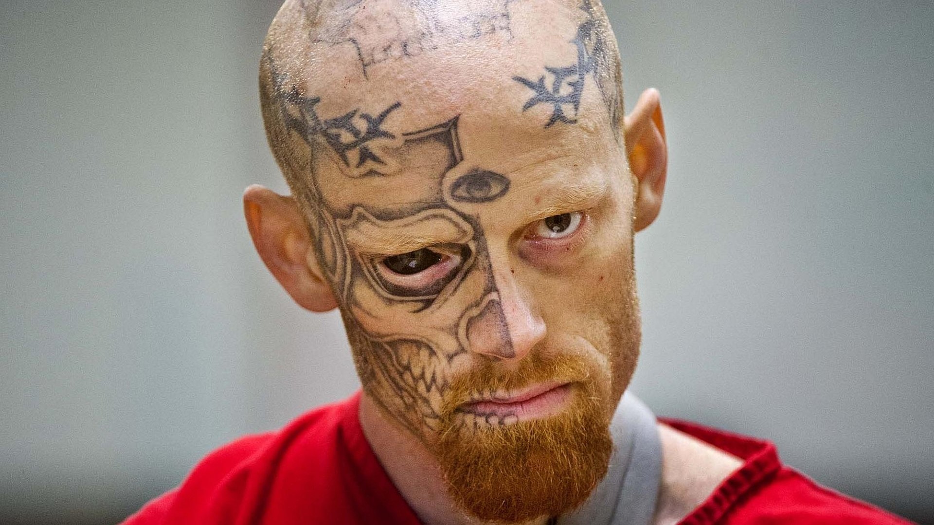 Jason Barnum looked ferociously at the camera with a tattooed part of his face and on his right eye
