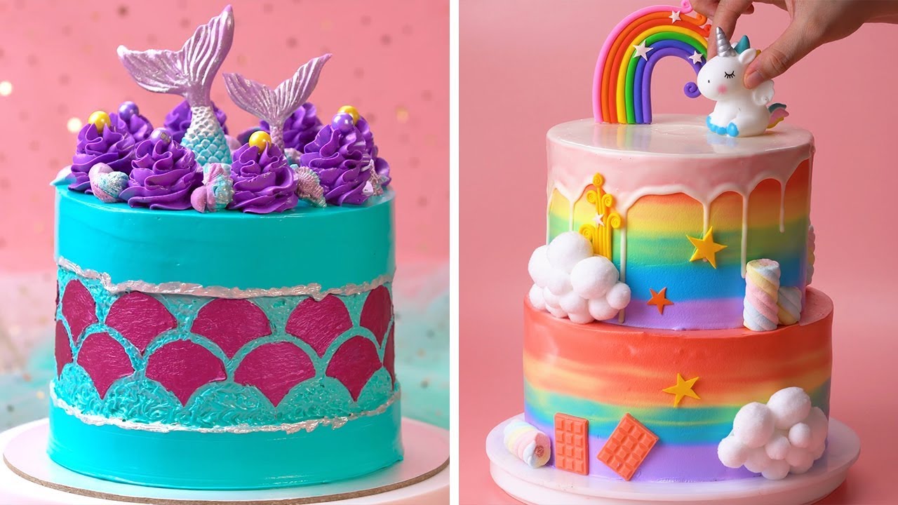 Blue-mermaid themed cake; rainbow-themed cake