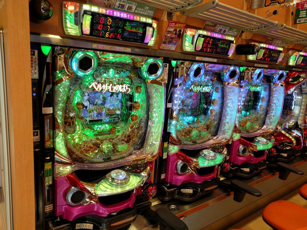 Pink and green Pachinko machines in a casino