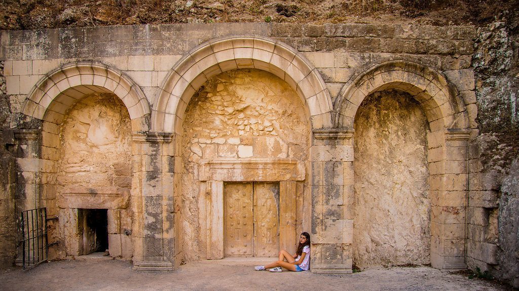 A girl sitting outside of Beit Shearim cave