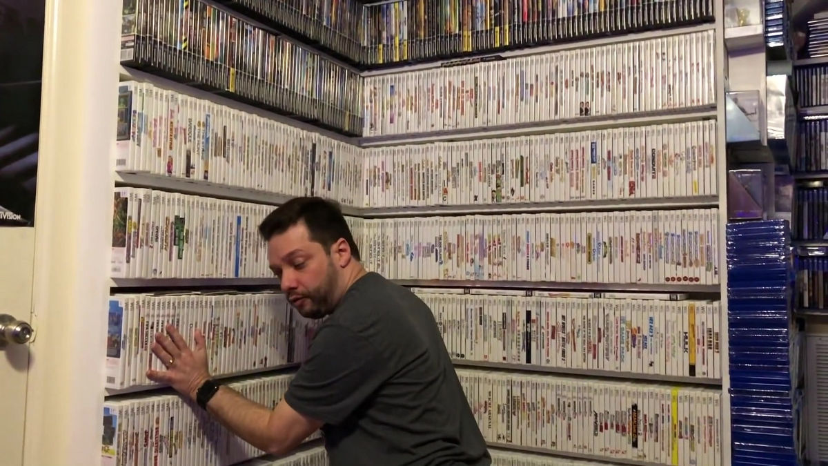 Antonio Monteiro showing his video game collection library