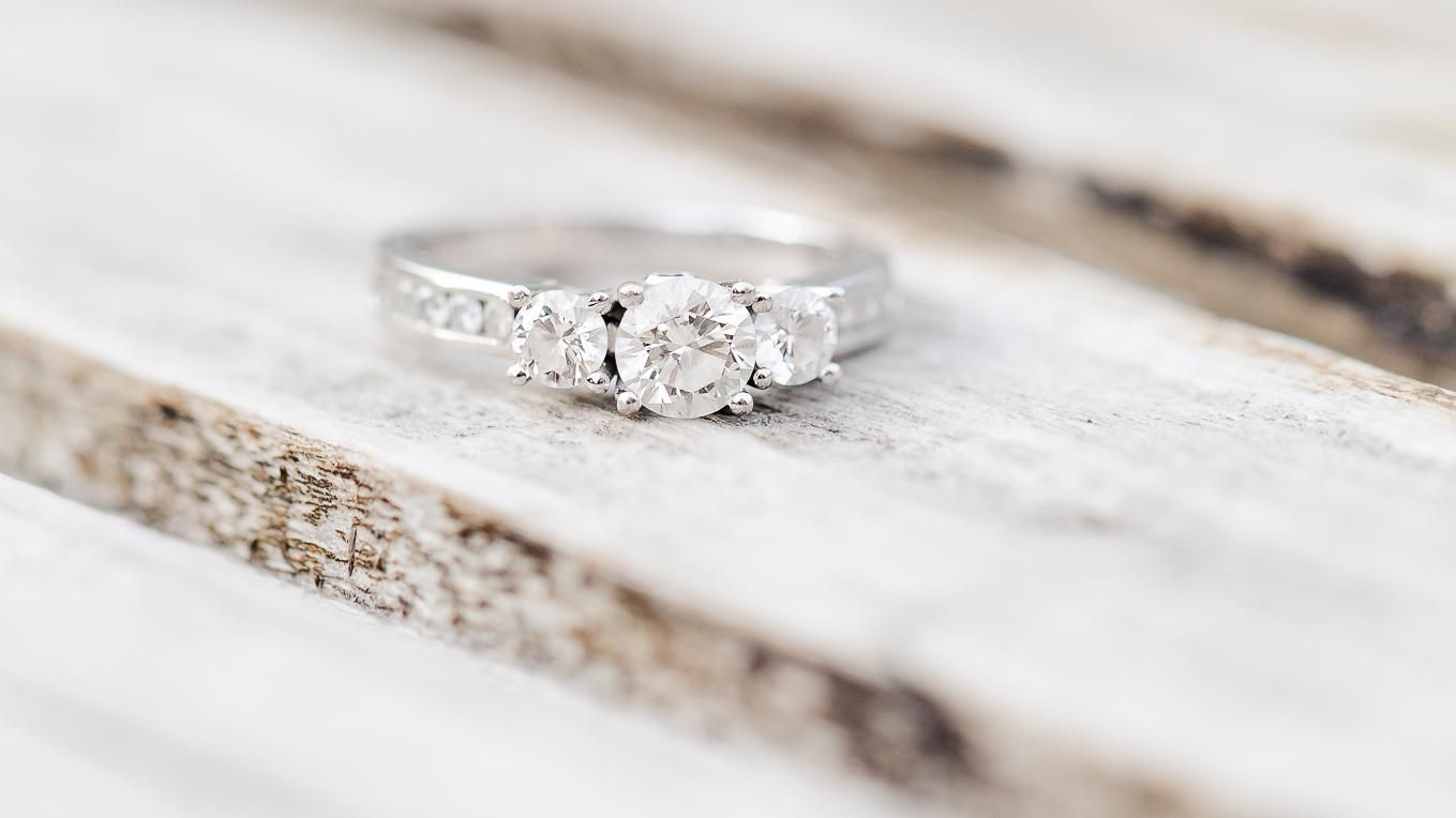 Diamond ring placed on a wooden table