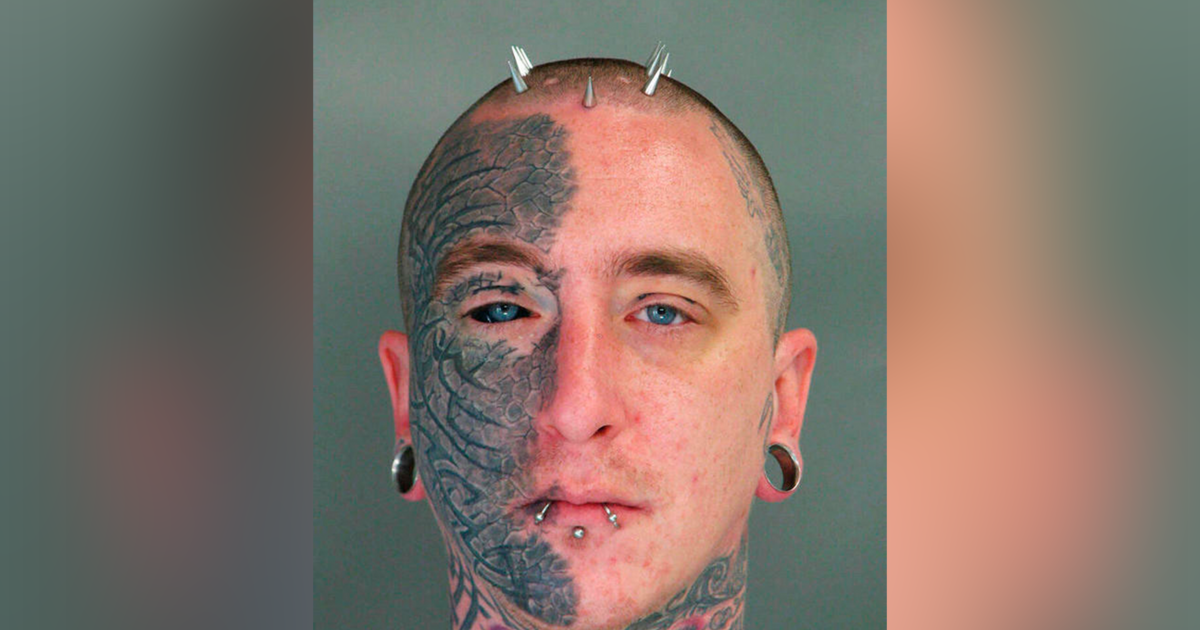 Jeremy Pauley, a man with tattoos and piercing on his face