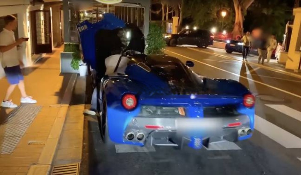 A blue Ferrari Hypercar crashed
