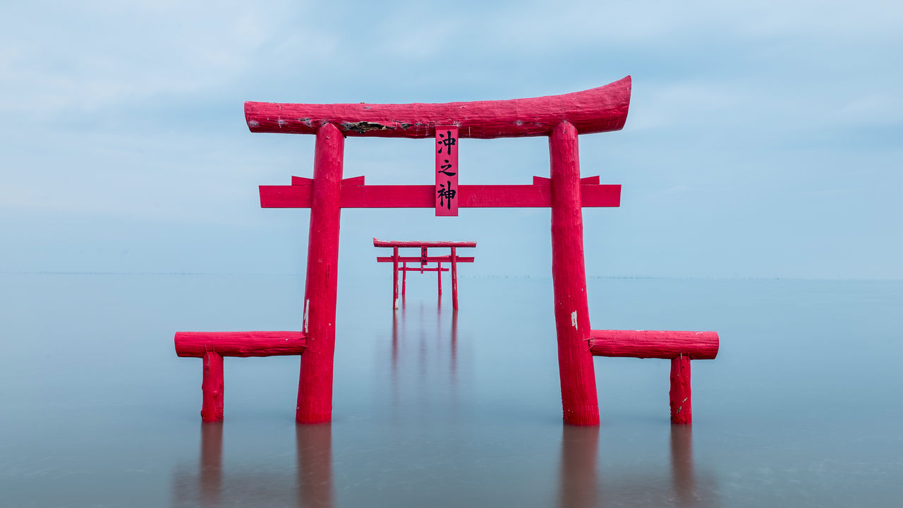 Red-colored Torii gates in the sea