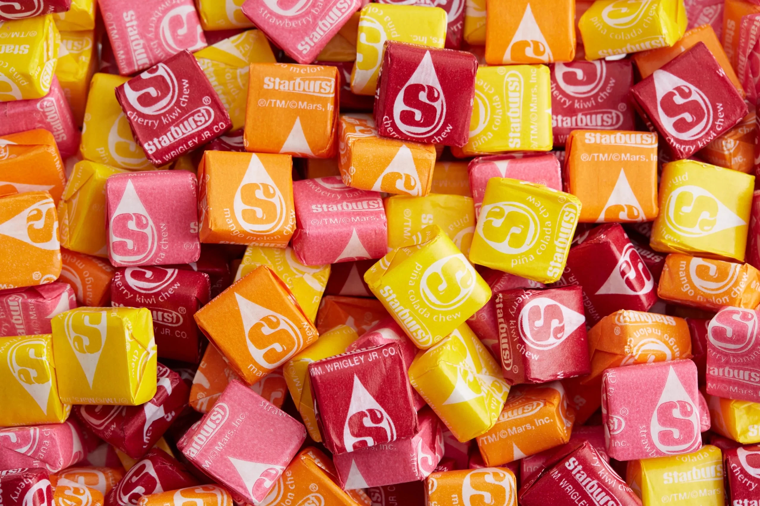 Yellow, orange, red, and pink colored Starburst Lollies
