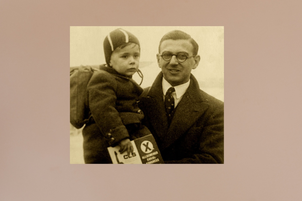 Young Sir Nicholas Winton holding a kid