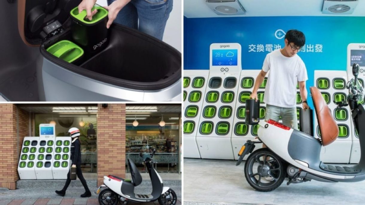 A man taking out Gogoro electric batteries and putting it into his scooter