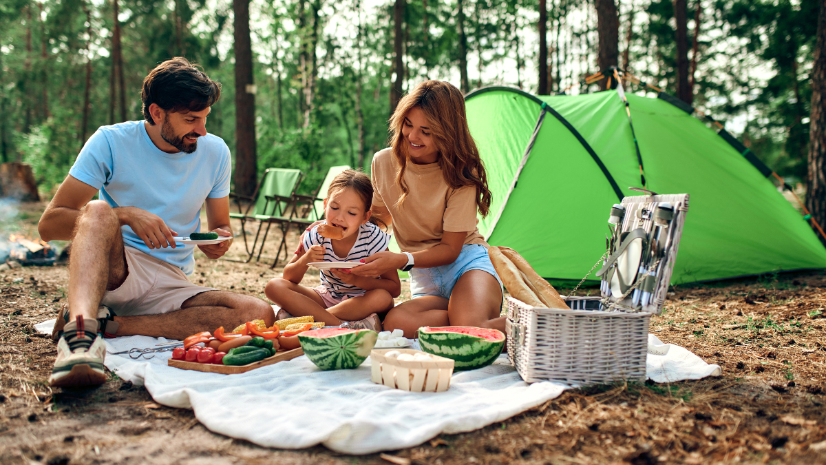 A family enjoying camping in the forest