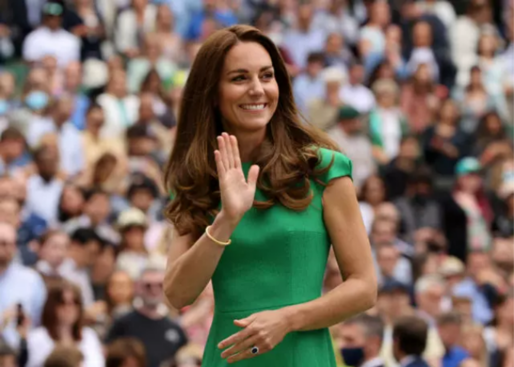Kate Middleton is dressed in a green gown and waves to the crowd