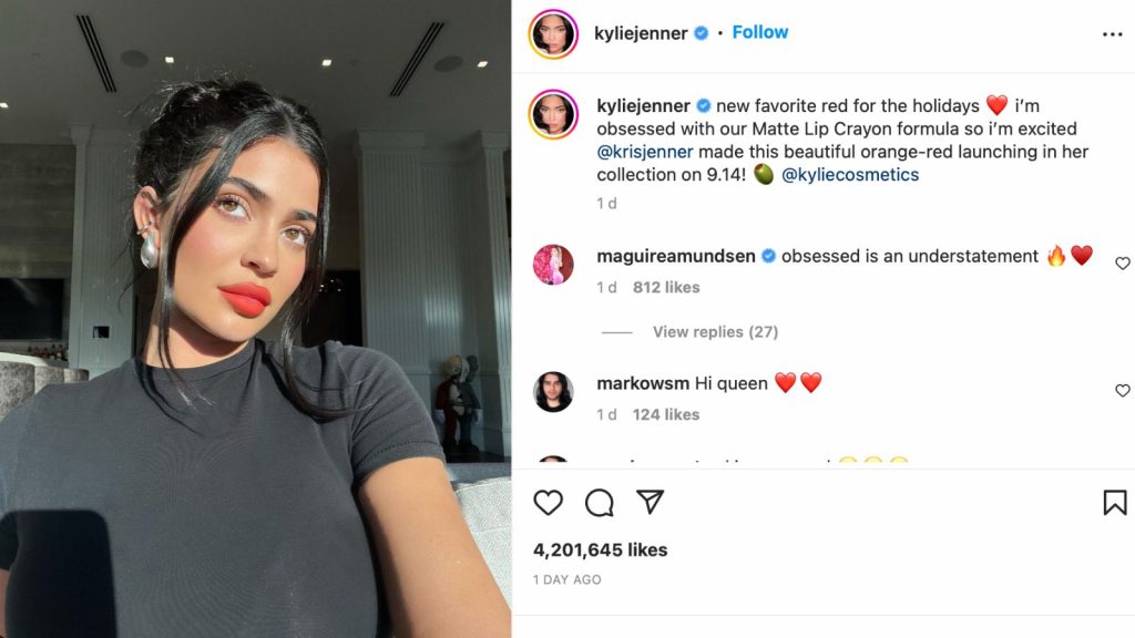 Kylie Jenner posing for a selfie with a red lipstick; Some comments from her instagram post