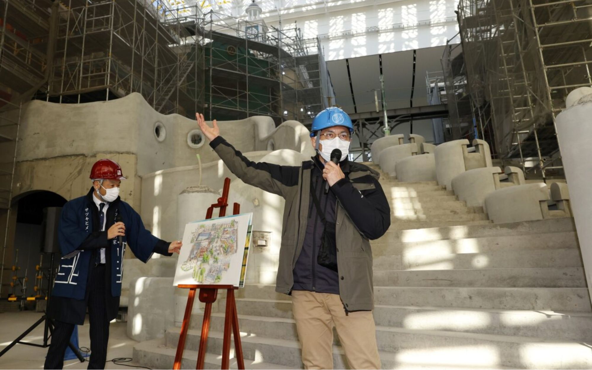 Director Goro Miyazaki first shows the construction site while wearing a blue hard hat on his head