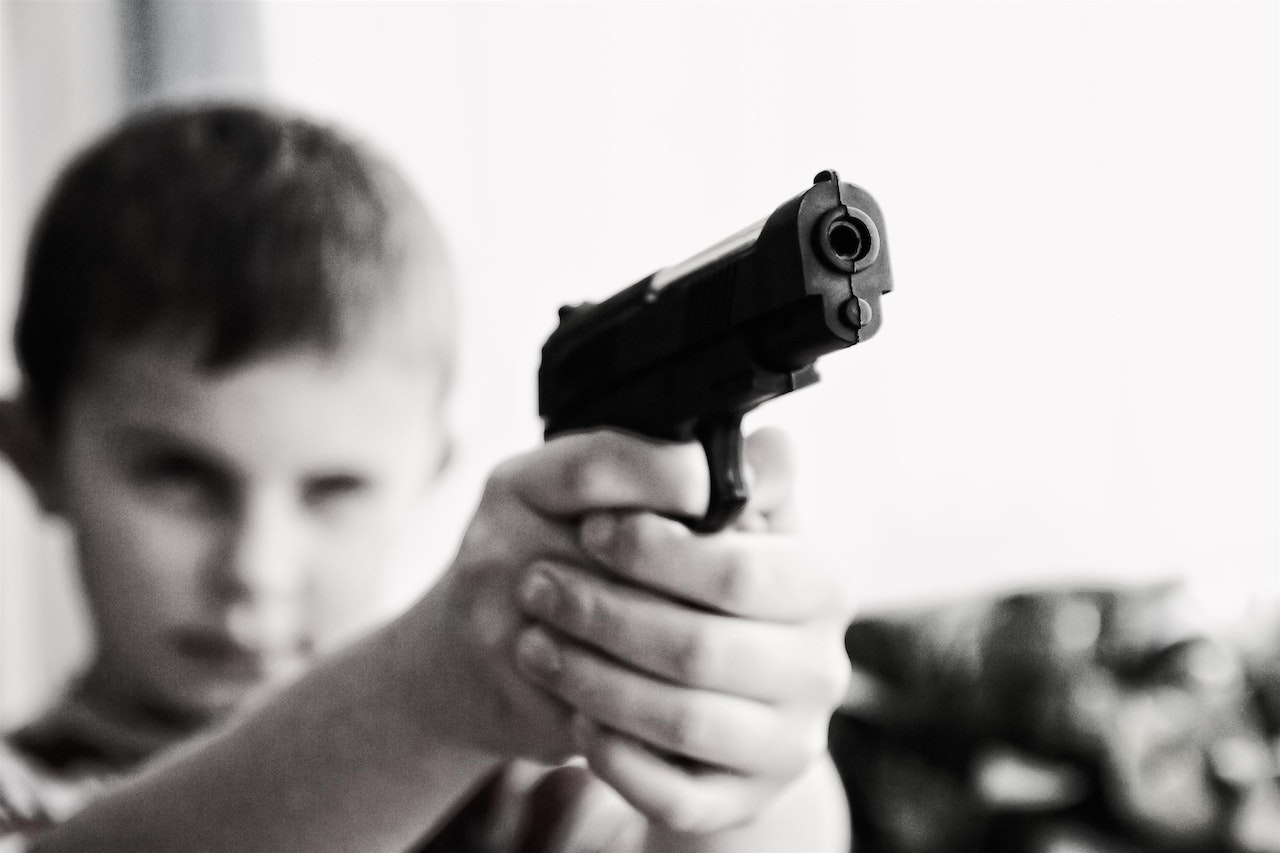 Boy Aiming Toy Gun