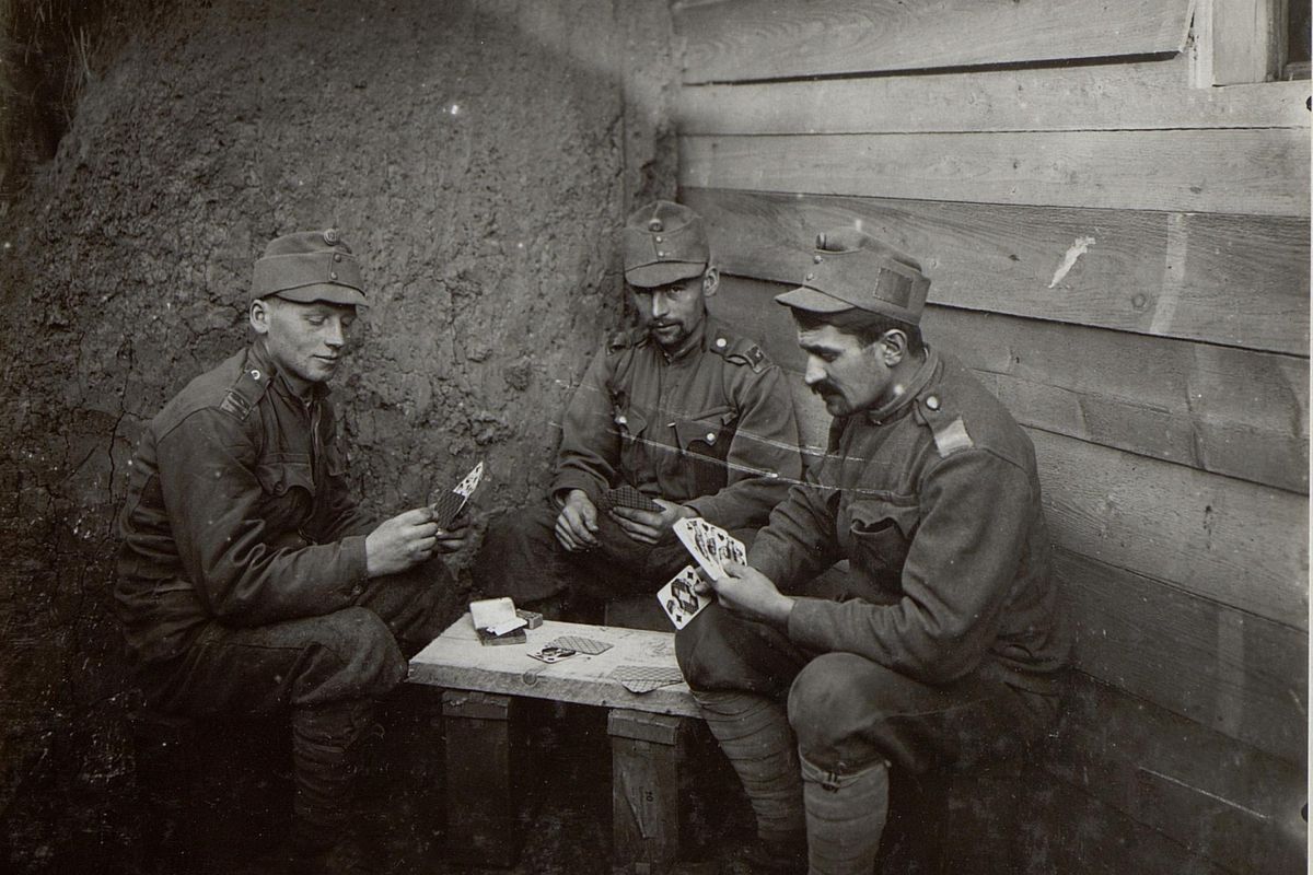 Three American soldiers playing poker