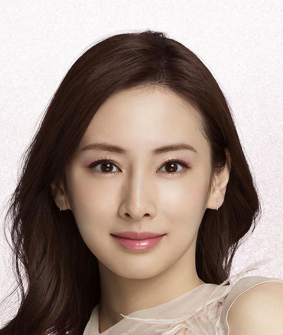 Keiko Kitagawa wearing pink makeup with white top