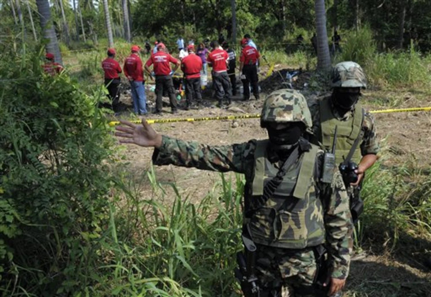 Mexican army and a government team investigating the shootout place