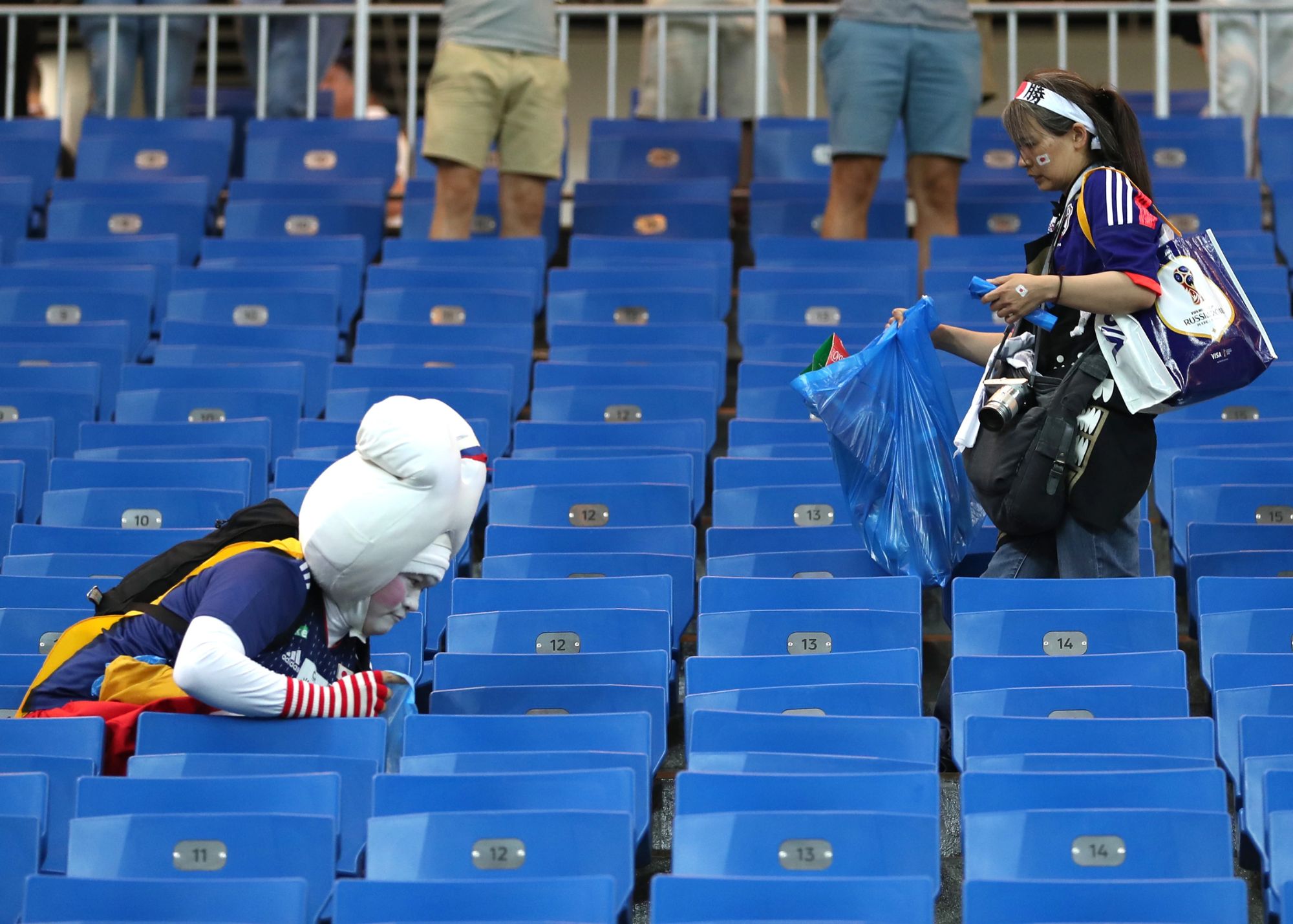 Japan Fans Stayed Late To Help Clean The World Cup Arena