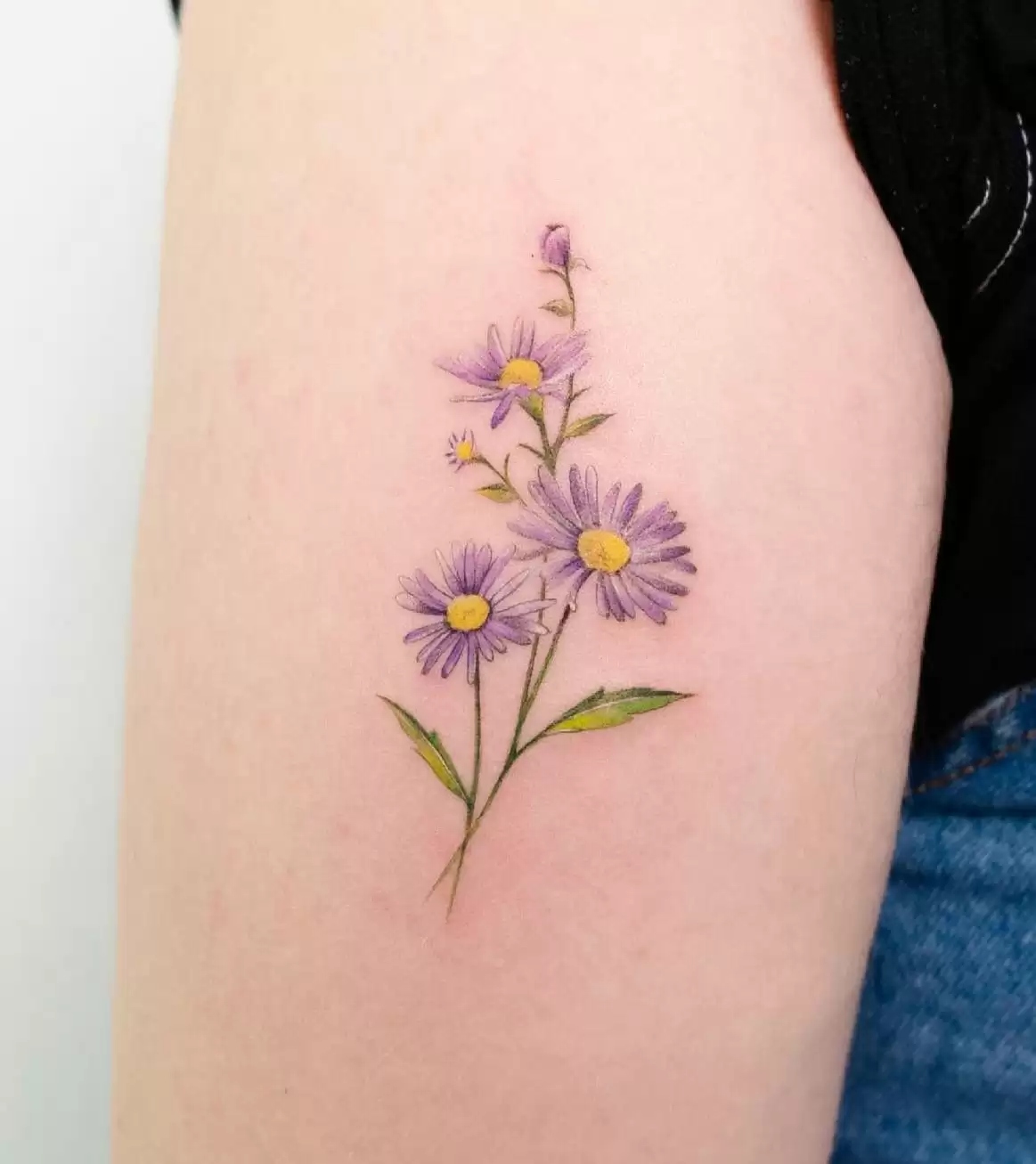 Minimalist purple Aster flower bouquet tattoo