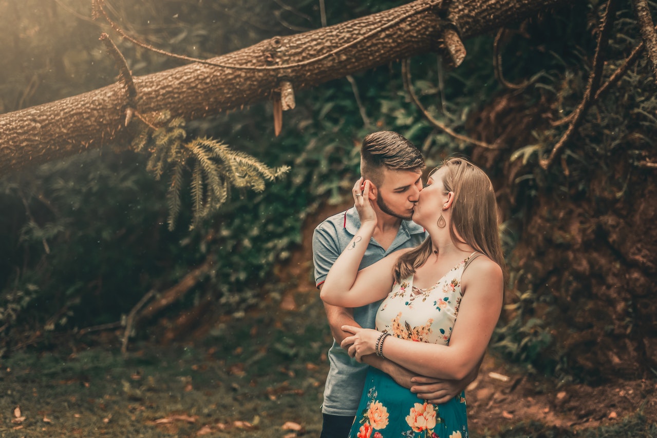 Couple kissing in the forest