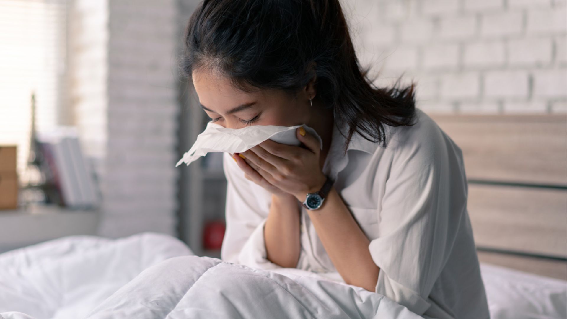 Women Holding Coughing With Tissue On Mouth