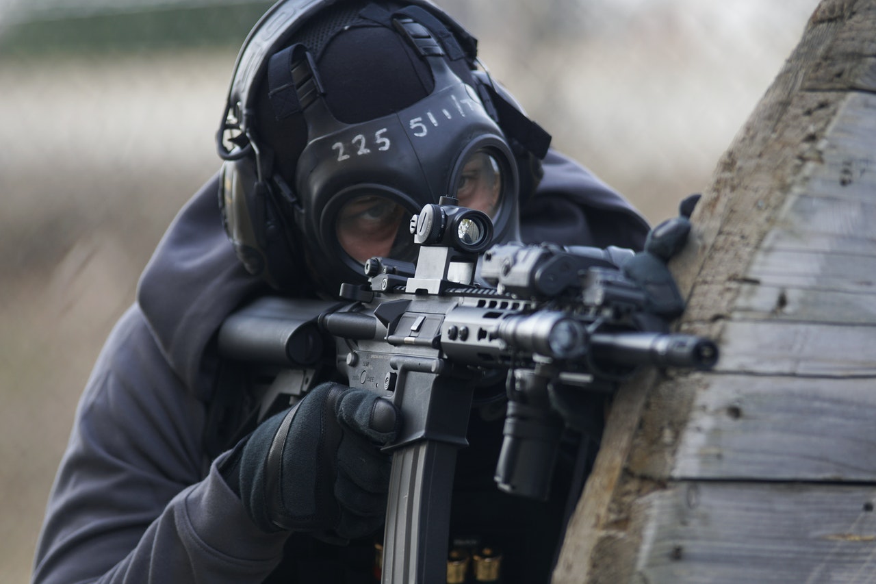 A Person Holding Airsoft Gun Wearing Protective Gears