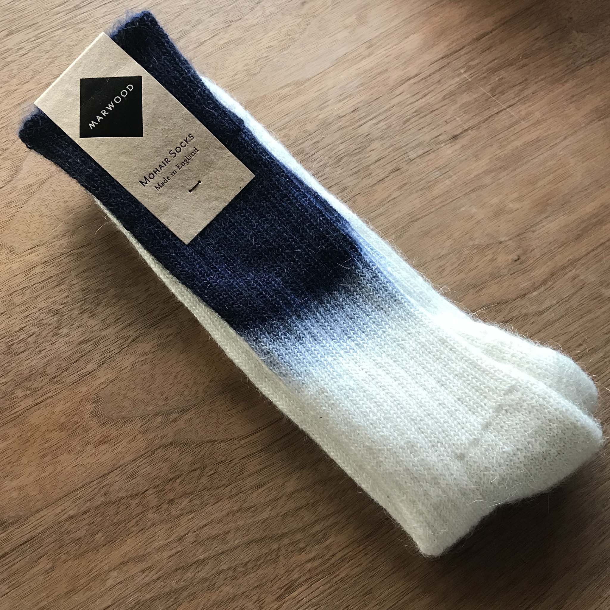 A pair of marwood sock with white and dark blue gradient