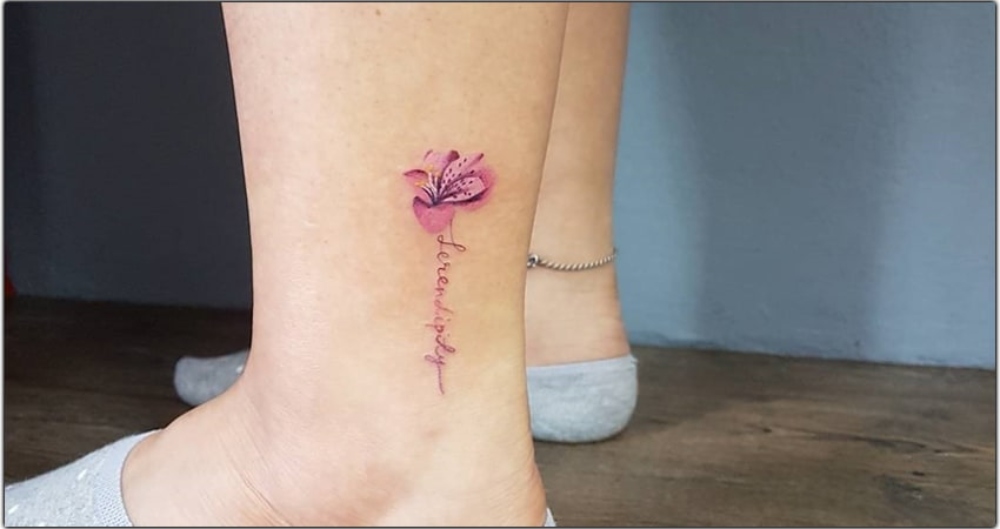 Pink Alstroemeria tattoo on leg of a girl