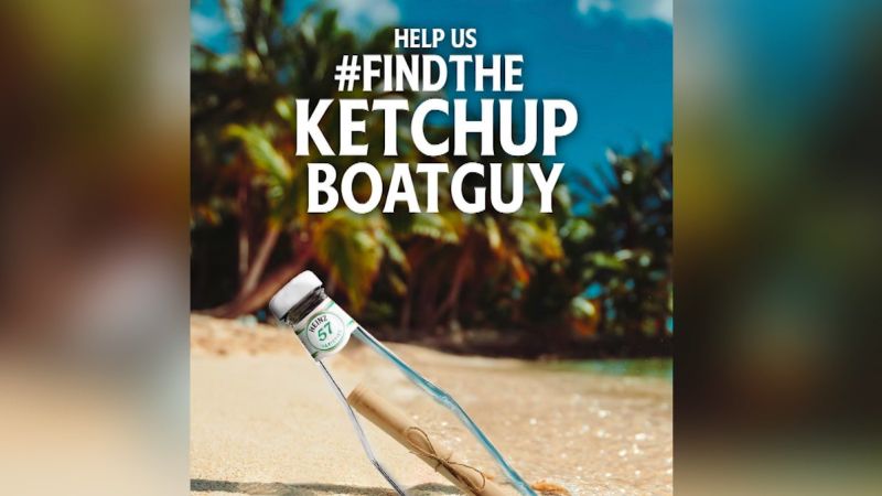 Help us #find the ketchup boat guy written on photo with a bottle of heinz on the sand in the beach