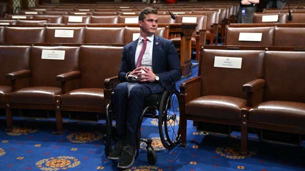 Madison Cawthorn sitting on wheelchair while wearing formal attire