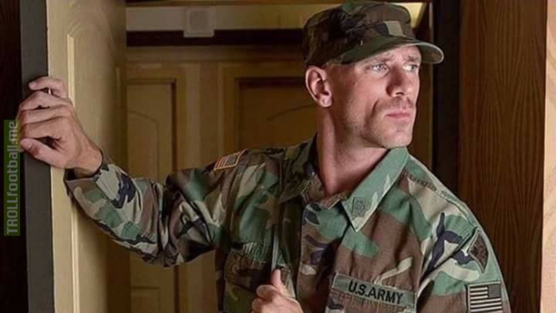 Johnny Sins wearing an army uniform while standing at the door