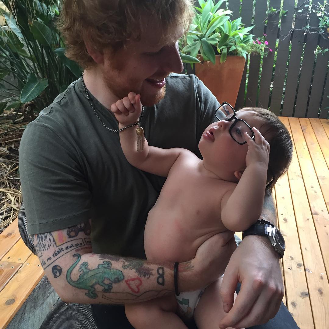 Ed Sheeran holding a baby