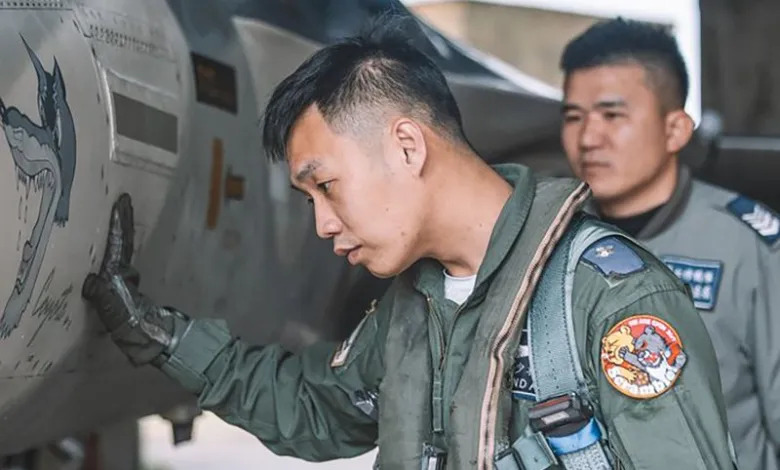 Man from Taiwan's air force uniform with the viral Xi caricature badge in his shoulder