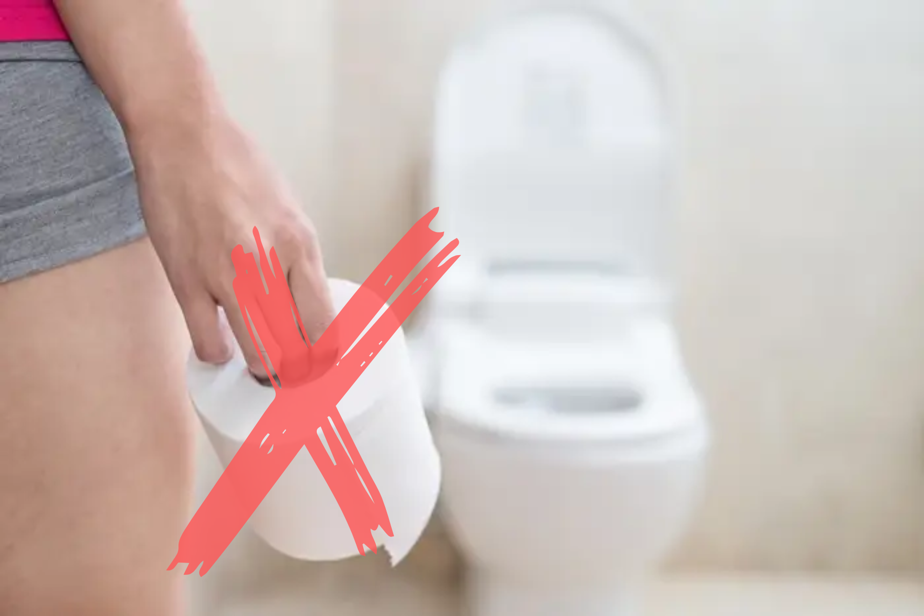 A woman is about to go a toilet while holding a scented tissue that has an X sign