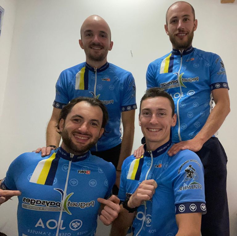 Four French Cyclists who earned a Guinness World Record Title for Largest GPS Bike Drawing wearing their blue cycling uniforms