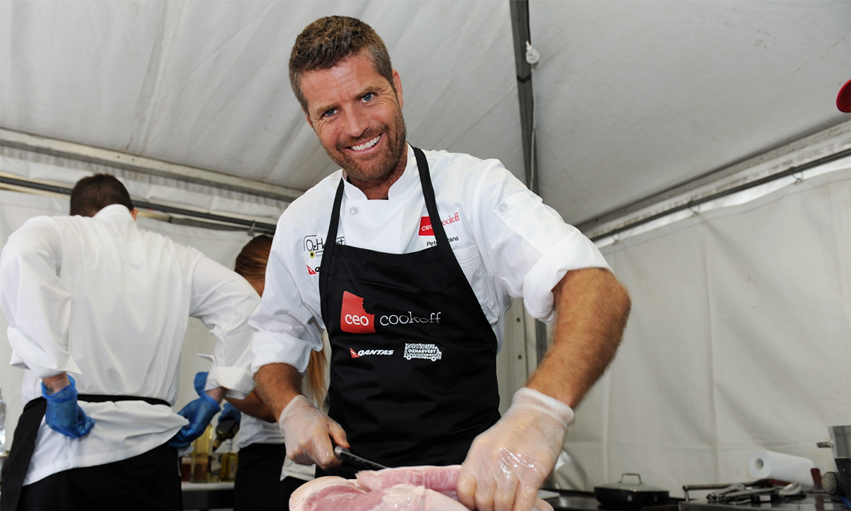 Australian chef pete evans cutting meat
