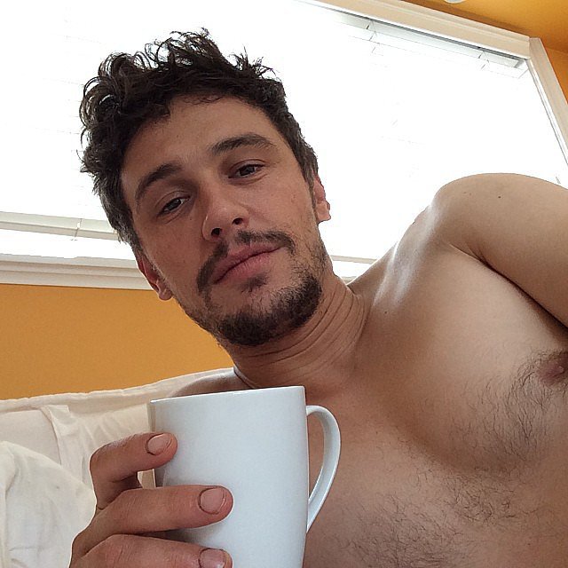 James Franco holding a cup of coffee