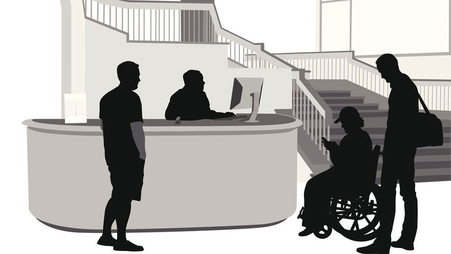 A disabled person, and two normal persons at a hotel reception