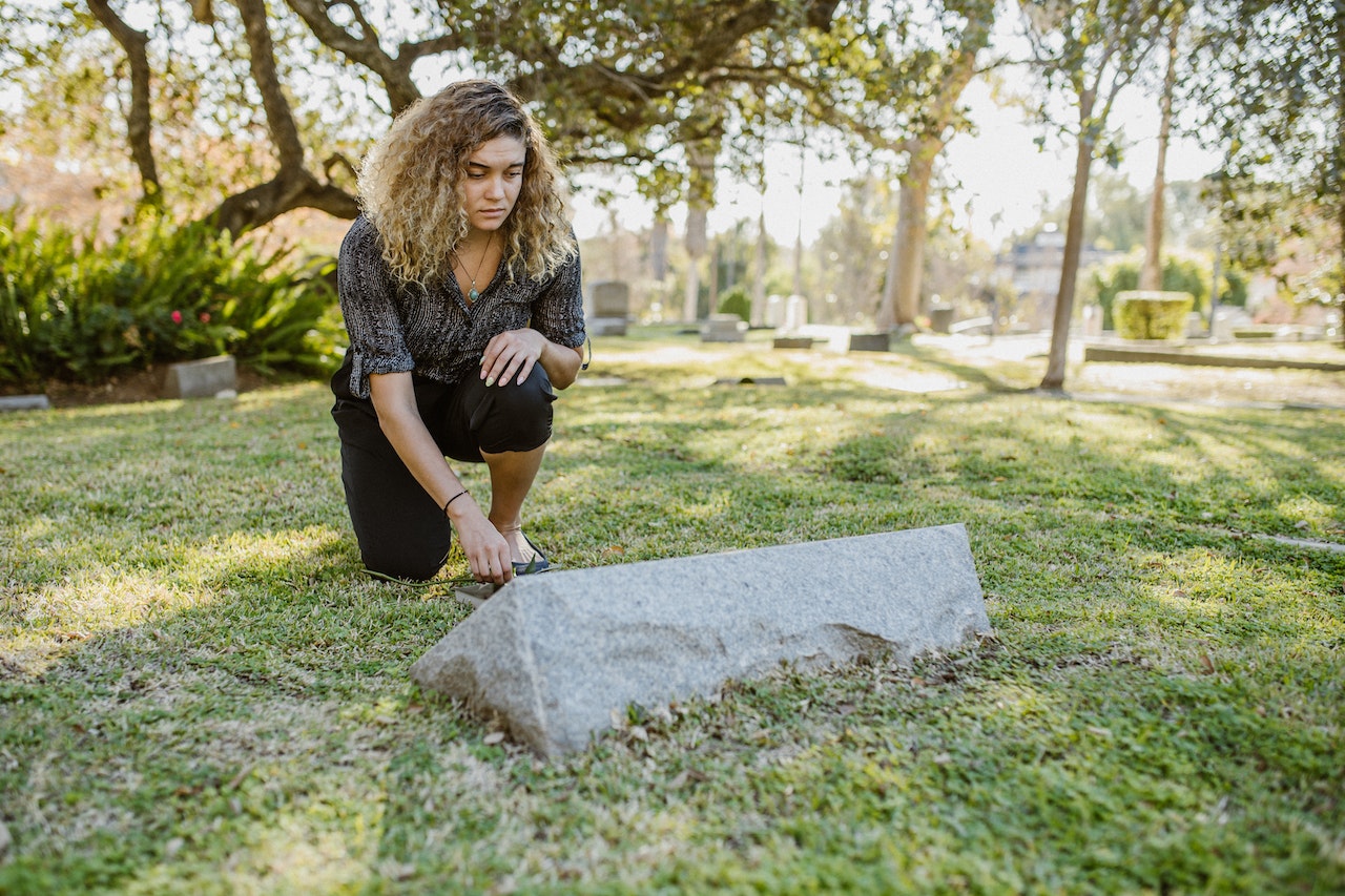 A Woman Visiting the Cemetery