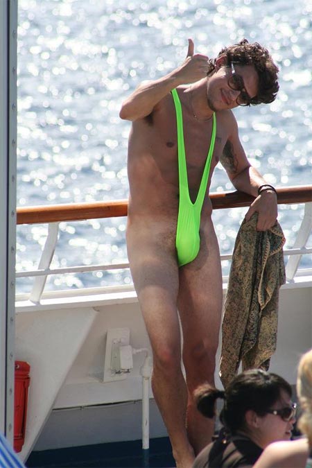 John Mayer wearing a green bathing suit