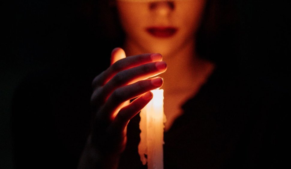 A woman holding a candle