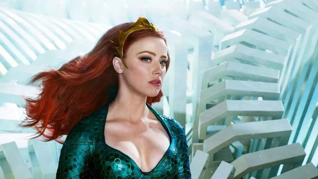 Amber Heard in her iconic green dress in Aquaman