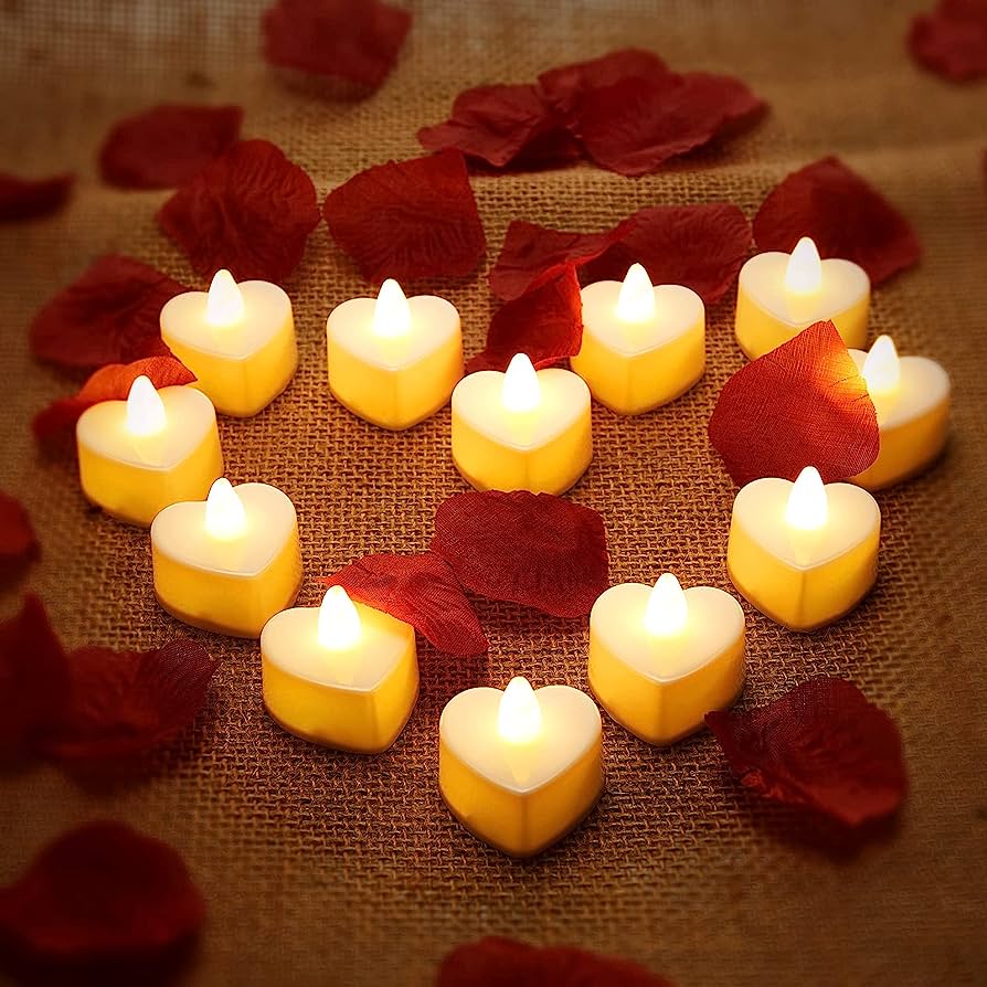 Heart-shaped candles and rose petals