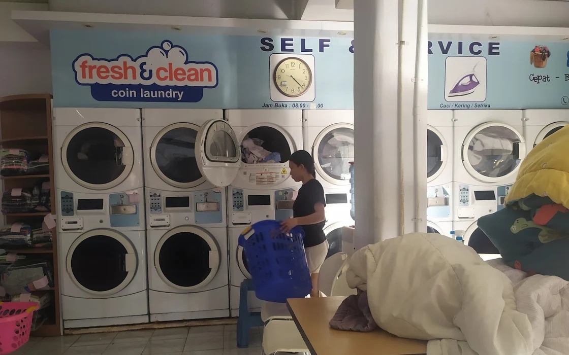 A person working in Fresh & Clean Coin Laundry