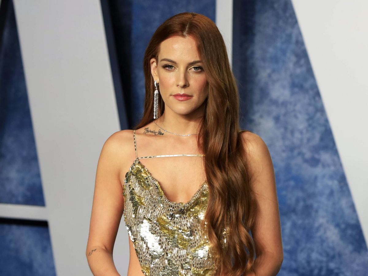 Riley Keough wearing a gold sequin dress