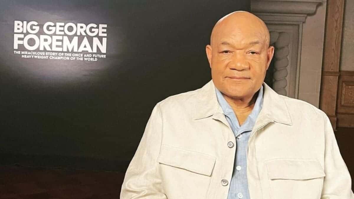 George Foreman wearing a beige jacket