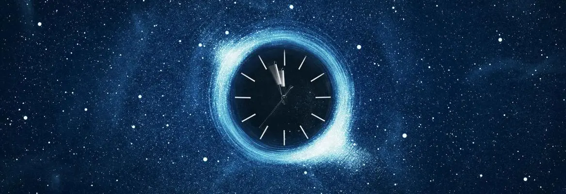 A clock in sky during night.